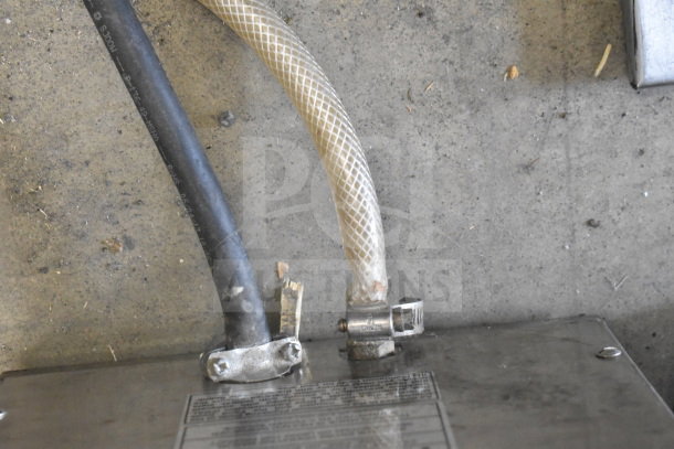 Bunn IC3 commercial countertop iced tea machine, 120/208 volts, 1 phase. Visible hoses and metal connectors. Condition needs verifying.