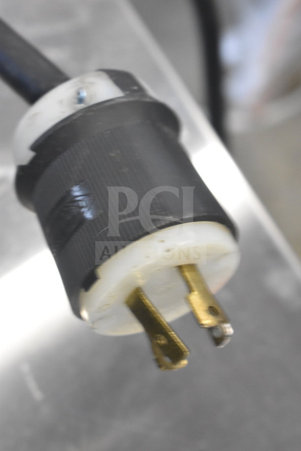 Plug of Bunn IC3 commercial countertop iced tea machine, 120/208 volts, 1 phase. Features three prongs, intact condition.