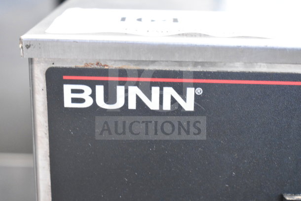 Bunn IC3 commercial countertop iced tea machine, showing Bunn logo. 120/208 volts, 1 phase. Visible wear on edges.