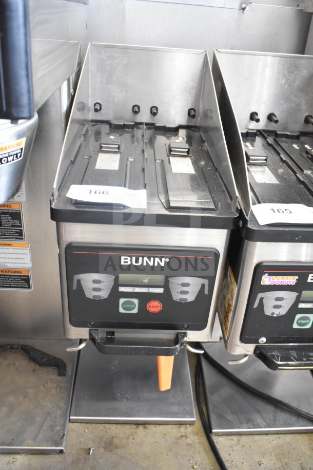 Bunn MHG commercial coffee grinder without hoppers, 120 volts, 1 phase, in used condition. Front panel shows control buttons.