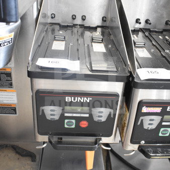 Bunn MHG commercial coffee grinder without hoppers, 120 volts, 1 phase, in used condition. Front panel shows control buttons.