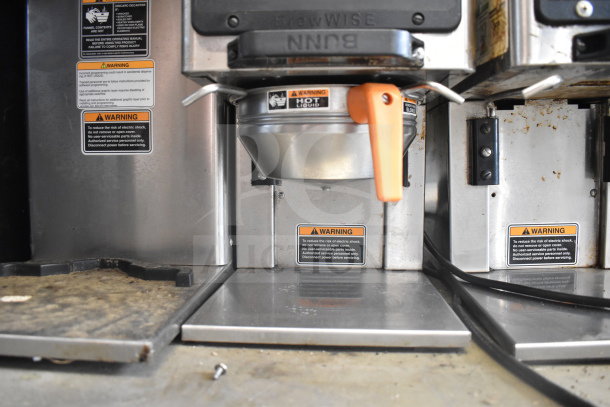 Bunn MHG Commercial Coffee Bean Grinder, no hoppers, 120V, 1 Phase, stainless steel, visible warning labels, used condition.