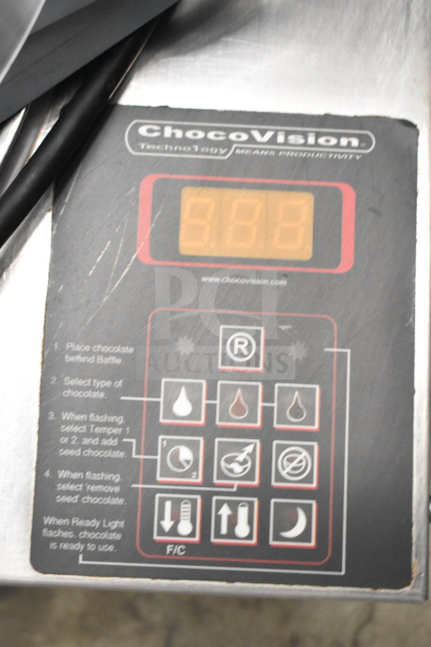ChocoVision Revolation X3210 Chocolate Tempering Machine panel with control buttons. 110V, 1 Phase. Visible ChocoVision logo.