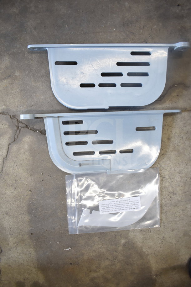 Two metal parts for ChocoVision Revolation X3210 Chocolate Tempering Machine, includes labeled bag with warning notice.