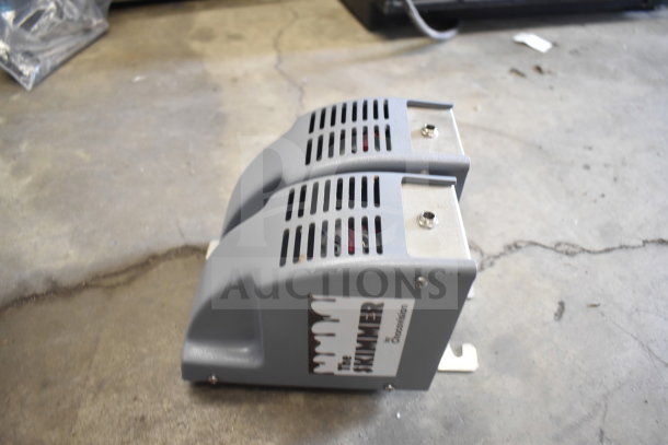 ChocoVision Revolation X3210 chocolate tempering machine, 110V, 1 phase, features ventilation vents, "The Skimmer" label visible.
