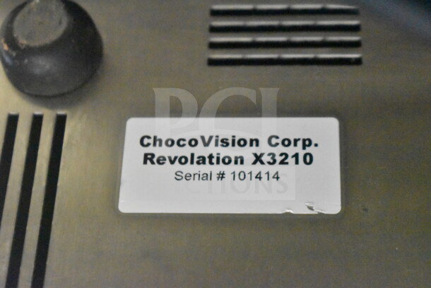 ChocoVision Revolation X3210 Chocolate Tempering Machine, serial #101414, 110V, 1 Phase, shown with label.
