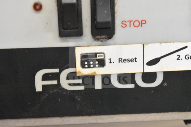 Fetco CBS-32Aap dual coffee machine with reset button, power switch, and instructions visible. Used condition.