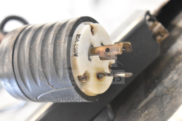 Scotsman Prodigy C0530SA-1B commercial ice machine head with visible power plug, marked 20A 250V, on ice bin.