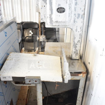 Hobart commercial floor style meat saw, metal construction, visible wear and rust, branded logo on upper panel.