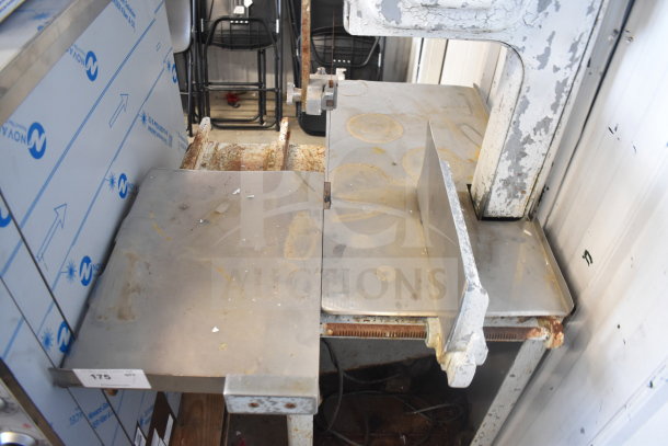 Hobart commercial floor style meat saw, showing signs of wear with rust and scratches, model label partially visible.