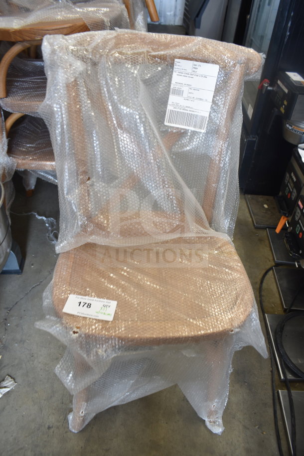 Brand new Flash Furniture wood pattern cross back chairs wrapped in bubble wrap, minor scratches noted, auction lot of 17.