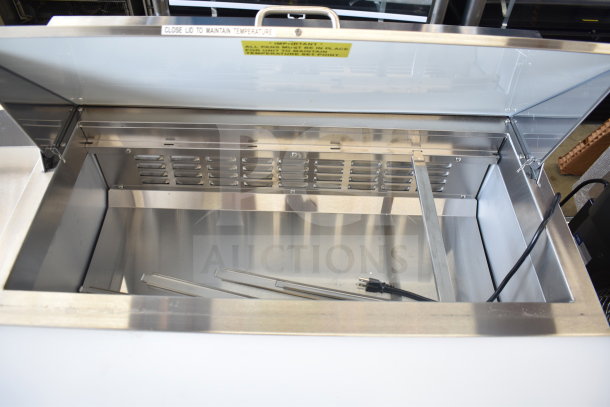 Brand new Avantco 178APT36HC commercial prep table, 115V. Features Bain Marie Mega Top, some scratches and dents visible.
