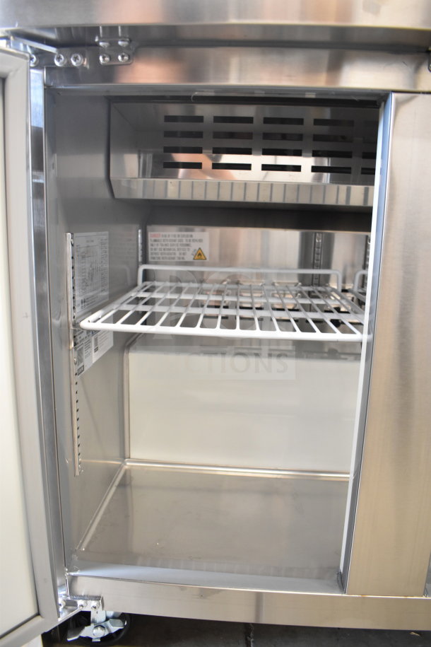 Avantco 178APT36HC Sandwich Prep Table interior view, showing stainless steel shelves and design, 115 Volts, new condition.