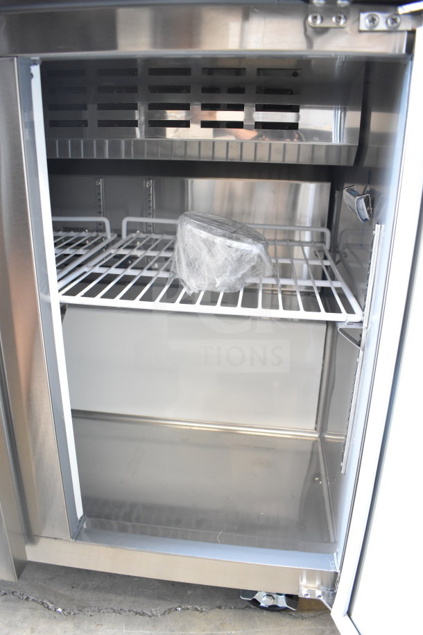 Brand new Avantco 178APT36HC Sandwich Salad Prep Table, 115V, shown with internal shelves and wrapped component.