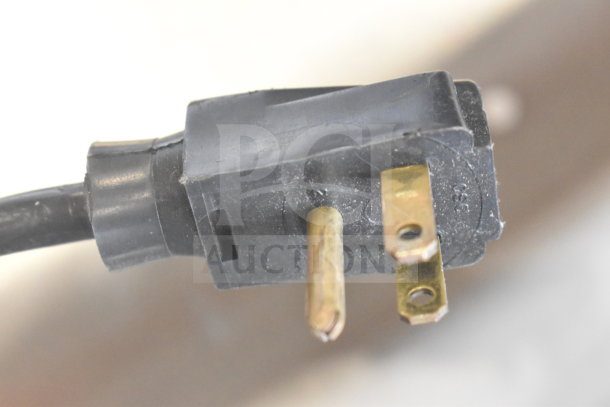 Close-up of power plug for Silver King SKMAJ2/C4 Commercial Milk Dispenser, 115 volts, showing three prongs.