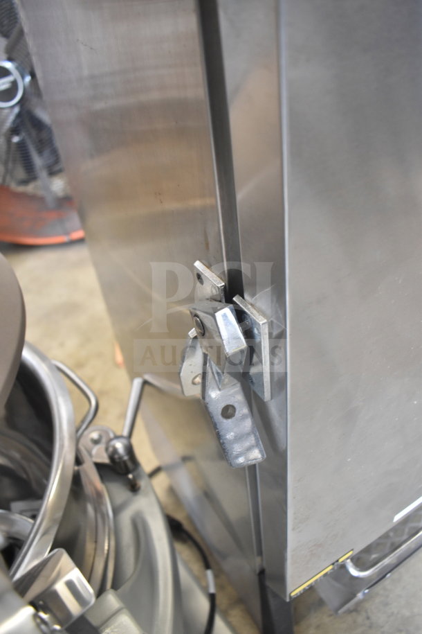 Silver King SKMAJ2/C4 milk dispenser, stainless steel, 115 volts, 1 phase, good condition, visible latch mechanism.