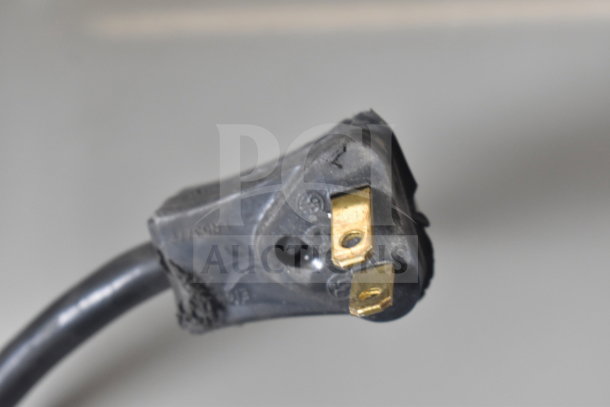 This image shows a close-up of a power plug with visible wear, likely belonging to the 2019 Habco SE18 cooler.