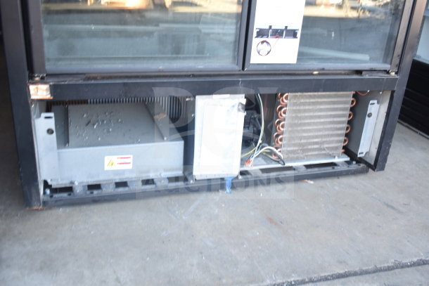 2021 True TVM-48SL-HC commercial 2-door reach-in cooler, 115 volts, open lower panel showing components.