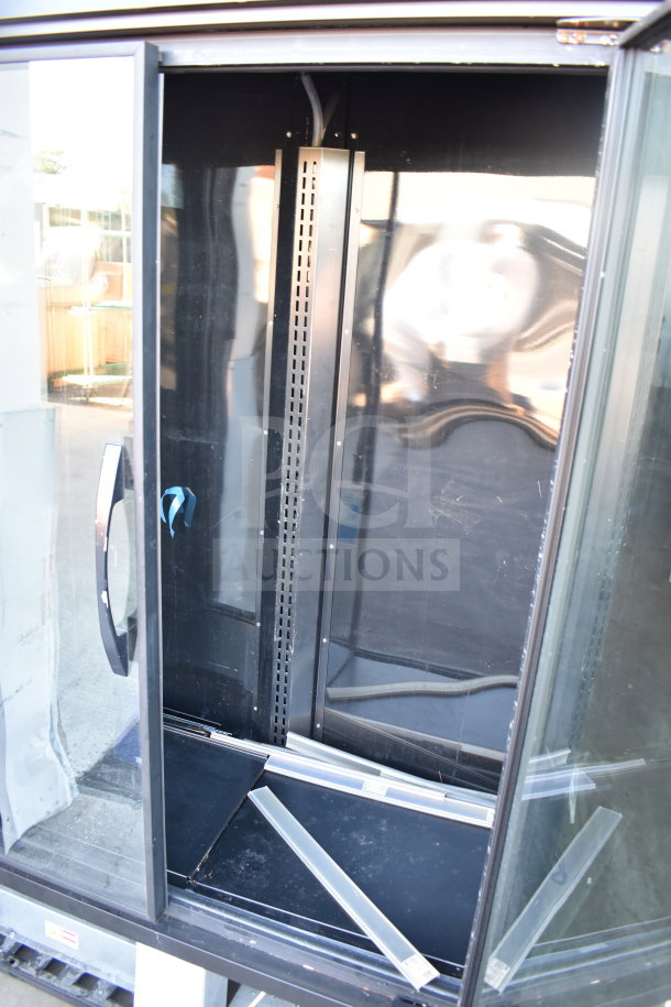 2021 True TVM-48SL-HC 2 Door Reach In Cooler, 115V, 1 Phase, commercial use, open glass door, interior shown.