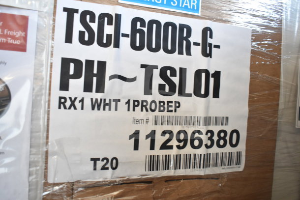"New 2026 True TSCI-600R-G-PH cooler, commercial single door, scratch and dent, 115V, 1 phase, barcode tag visible."