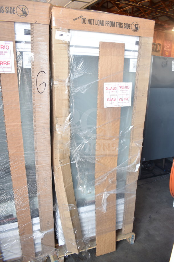 Brand new 2026 True TSCI-600R-G-PH single door cooler, 115V, in packaging. Scratch and dent condition; wrapped for protection. Tags indicate "Glass."