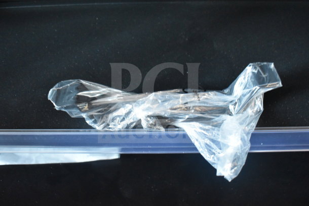 Plastic-wrapped components for Avantco 193VAC46B Refrigerated Air Curtain Merchandiser on black background.
