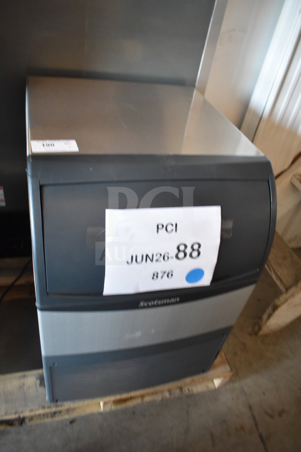 BRAND NEW Scotsman UF424AX-1A 24" undercounter flake ice machine, 80 lb. bin, 440 lb. capacity, 115V, tags indicate model and condition.