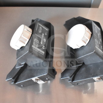Two meat slicer sharpeners, black with white knobs, marked with sharpening instructions. Condition appears good.
