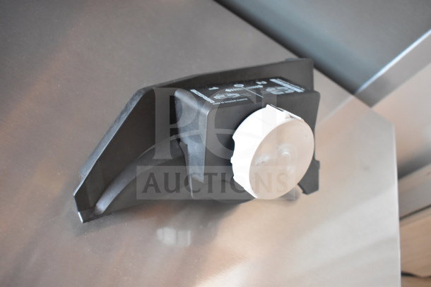 Two meat slicer sharpeners in good condition, featuring a compact black design with visible measurement markings.
