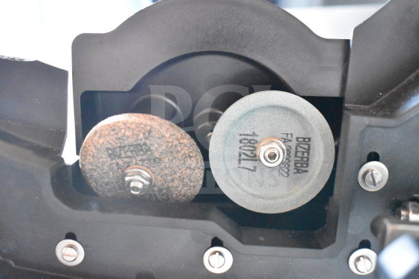 2 Bizerba meat slicer sharpeners, model FA002822. Includes grey and brown sharpening discs, good condition.