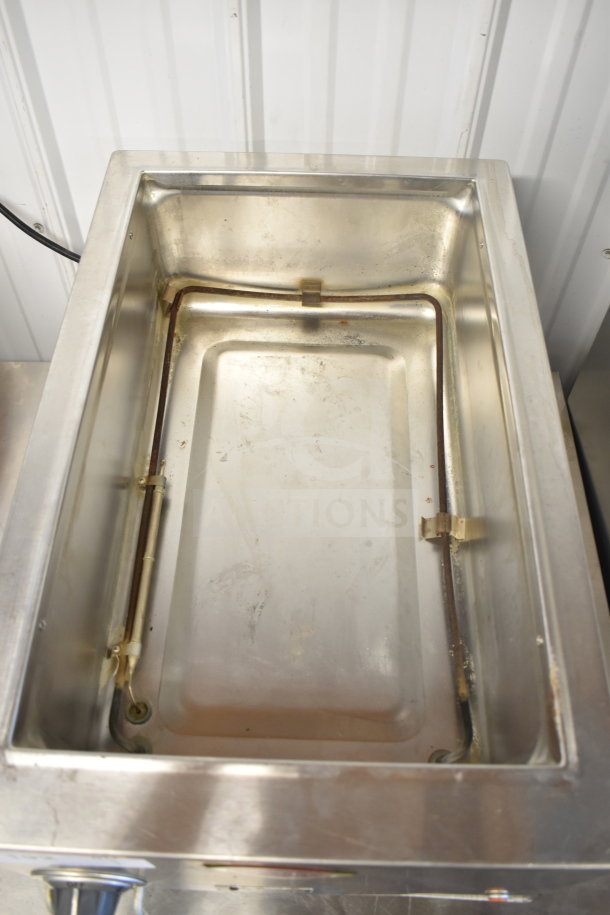 Wells HWSMP Commercial Countertop Food Warmer, stainless steel, 120 volts, 1 phase, used condition, visible heating element.