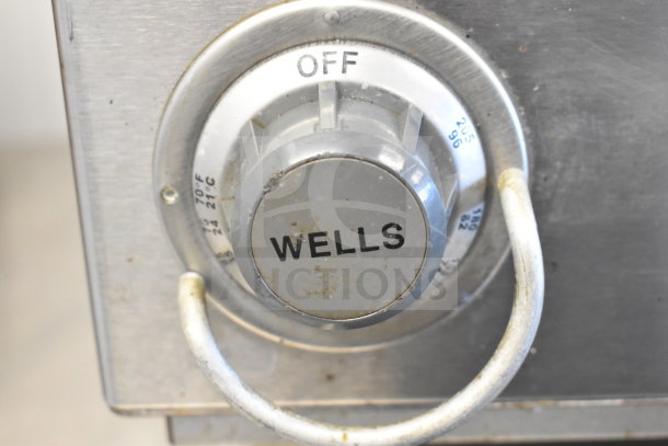 "Wells HWSMP Commercial Food Warmer dial, showing temperature settings, clean condition, 120 Volts, 1 Phase."