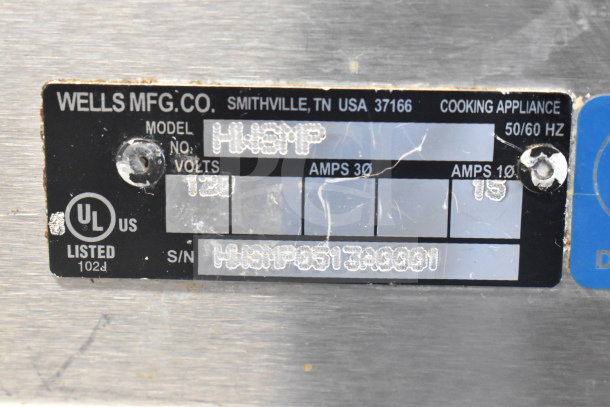 Wells HWSMP Commercial Countertop Food Warmer label, showing model, 120 volts, UL listed, serial number details.