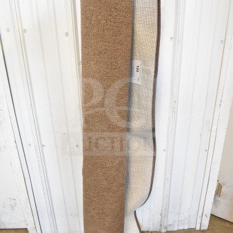 Mainstays Pecan Rug 60"x84", rolled. Textured brown surface, new condition. Tag marked "193, Qty 1."