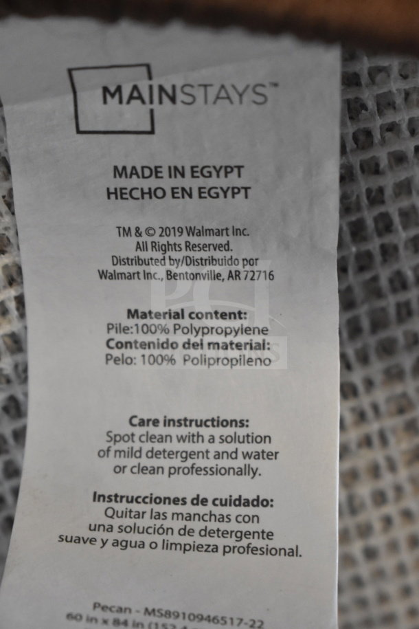 Mainstays 60"x84" Pecan rug, made in Egypt. 100% polypropylene. Spot clean care instructions included.