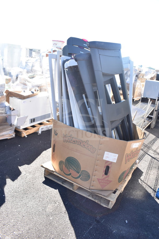 Lot of 18 items including Sensormatic AMS-113 Split Detectors in a large cardboard box, used condition, on a pallet outdoors.