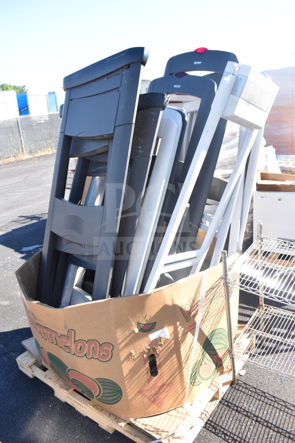 18 various security detectors, including Sensormatic AMS-113 Split Detector, stacked in a large cardboard box on a pallet.