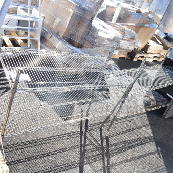 Two chrome finish wire shelves, excellent condition, sturdy design, ideal for storage and organization.