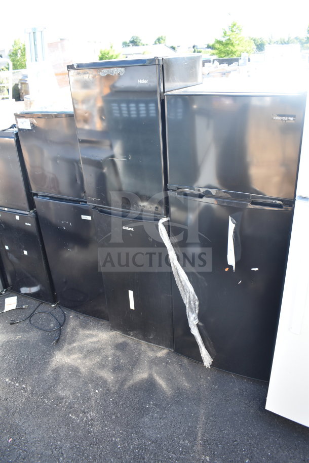 Five mini coolers including Igloo, MainStays; 120 Volts, 1 Phase; visible wear; markings indicate brands and models.