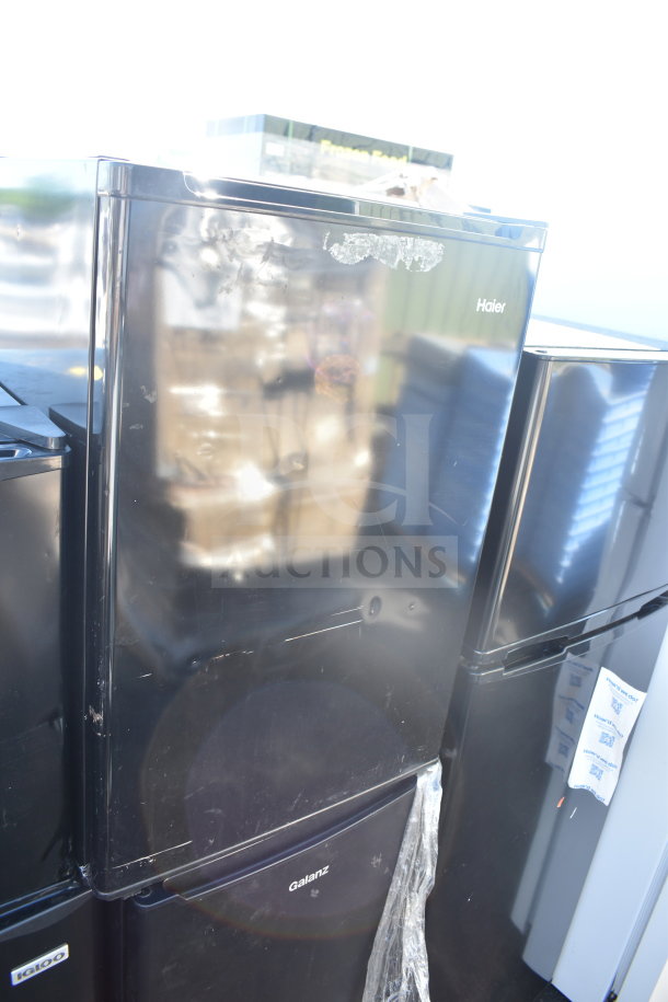 Five assorted mini coolers, including Igloo and MainStays, 120V, 1 phase. Visible logos: Haier, Galanz. Scratches present.