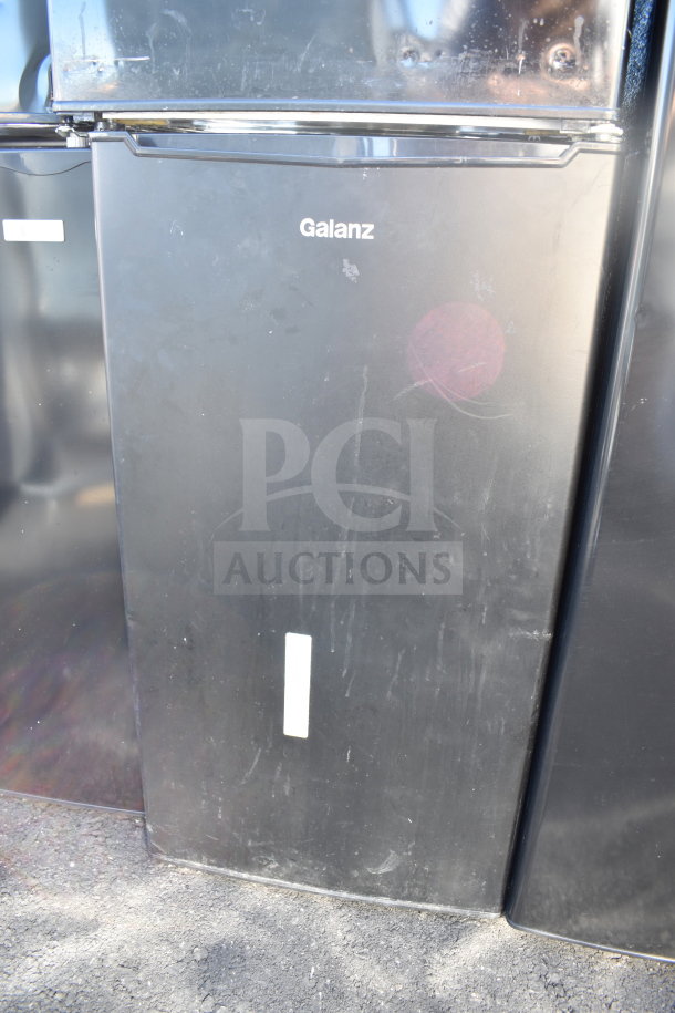 Five mini coolers, brands include Igloo, MainStays. Visible: Galanz cooler, black finish, 120V, 1 Phase. Auction lot.