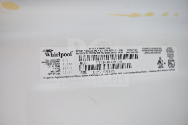 Whirlpool ET1MHKXMQ06 cooler with freezer label, showing model, 115V, 1 phase, design pressure, and serial number EU5106125.