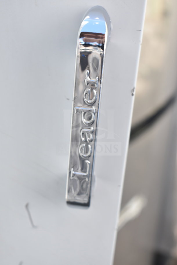"Leader" branded chrome handle on Bain Marie lid, new with minor scratches and dents, doubling buyer's bid value.