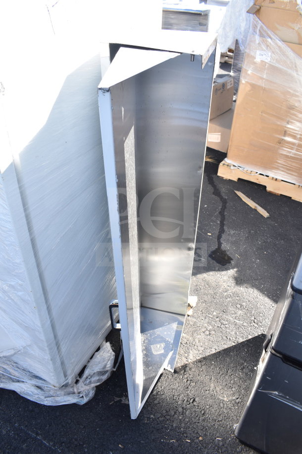Two brand new scratch and dent Bain Marie lids. Visible dent marks, reflective metal finish.