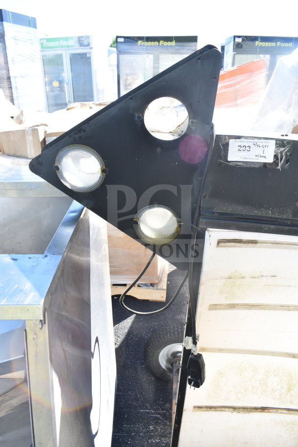 Vintage sign with letter slots, black triangular frame, three circular light fixtures, needs refurbishment, electric cord visible.