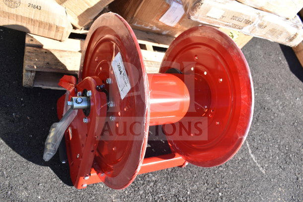 Brand new Reelcraft CA33112L hand crank hose reel, red, for 3/4" x 100' hoses, minor scratches, tag visible.