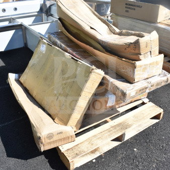 A pallet with boxed, scratch and dent items including Unger OmniClean Dual Bucket Kit and Regency Overshelf, some labels visible.