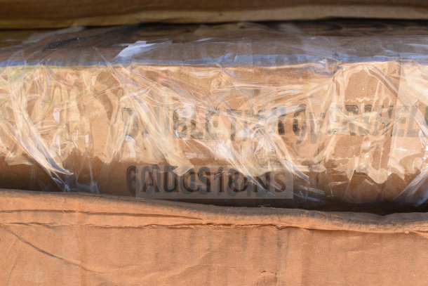 Packaged item with visible label "60DOS1848," indicating a Regency 600DOS1848 Over Shelf. Wrapped in protective plastic.