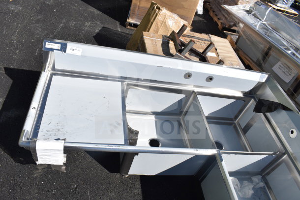 Regency 600S3242424C L-shaped commercial sink, brand new, 3 bays, dual drain boards, no legs, visible scratches.