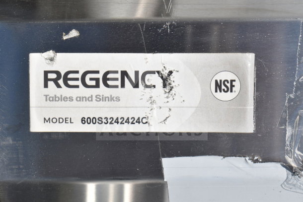 Regency 600S3242424C Commercial Sink label showing model and NSF certification. Scratches and dent visible.